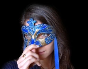 Image of a woman with a blue mask on her face.